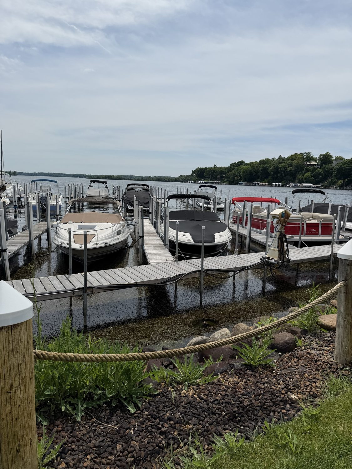 Ground-level view of Chapman Place Marina shoreline with boats and docks